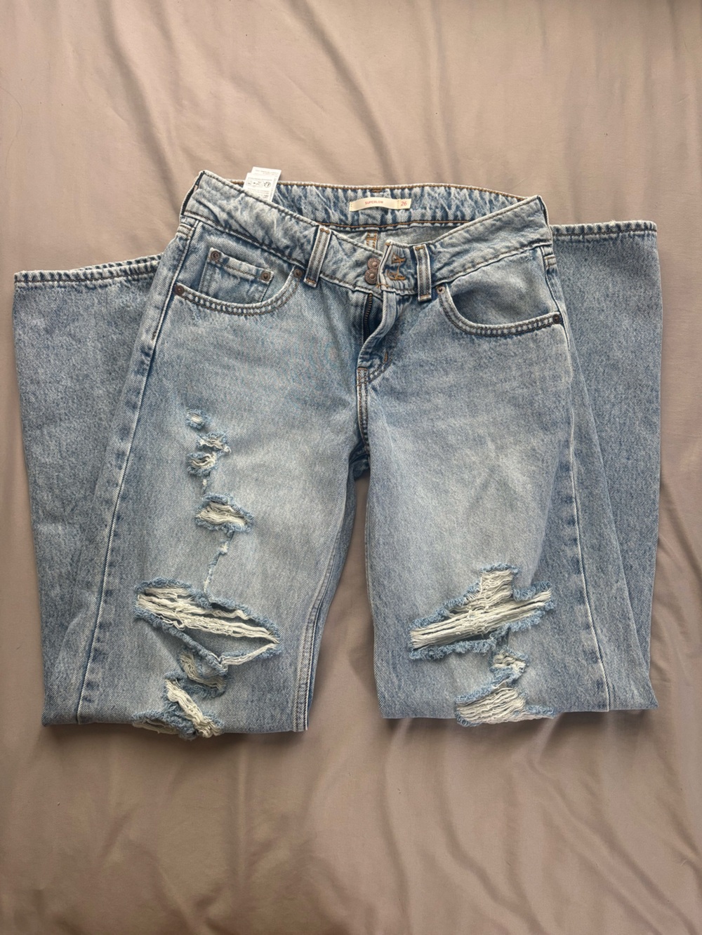 Distressed Light Blue Low Rise Levi’s Jeans for Women